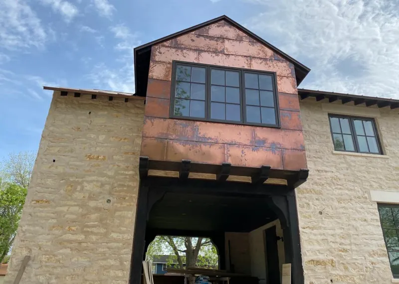 Copper metal panel facade on a stone building for Metal Roof Coating in Concord